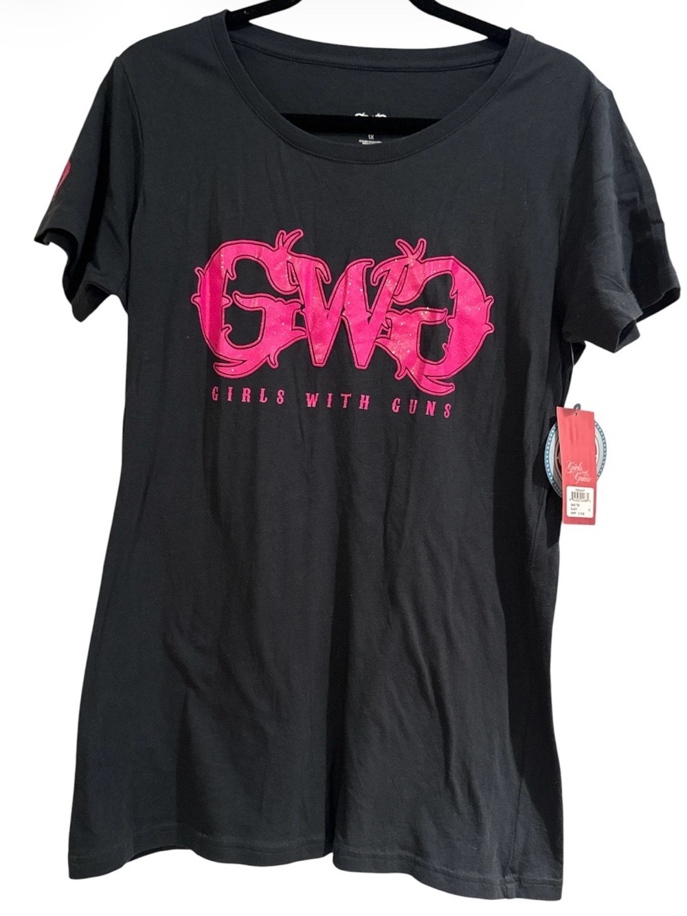 🆕 black "Girls With Guns" t-shirt features a bold pink graphic logo on the chest